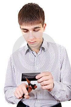 Teenager cutting a Credit Card