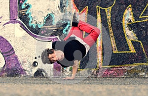 Teenager dancing break dance on the street