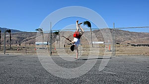 Teenager dancing breakdance in the street