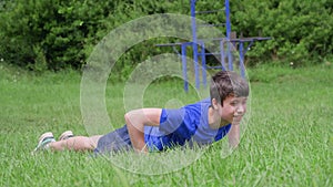 Teenager doing workout outdoors, healthy lifestyle