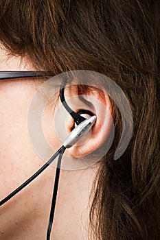 Teenager with earbud