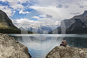 Teenager enjoys the stunning scenery at a Canadian lake