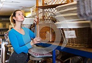 Teenager female choosing wicker ambry