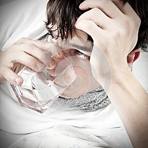 Teenager with Flu drinks Water