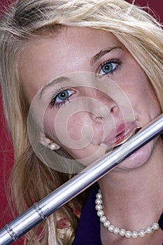 Teenager in Flute Performance on Red