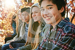 Teenager, friends and portrait in park, smile and together on holiday, nature and relax by trees. Youth culture, happy