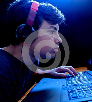 Teenager gaming on his Laptop