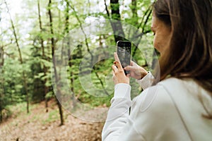 teenager gen z girl walking in the forest. close to nature concept