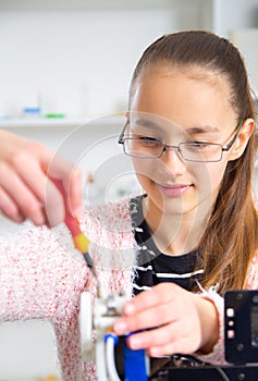 Teenager girl with 3d printe. education