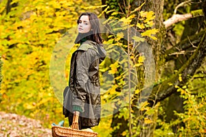 Teenager girl on autumn maple leaves at fall outdoors. Portrait of a beautiful teen. Young teenager girl looking to
