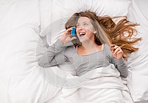 Teenager girl bed cell phone