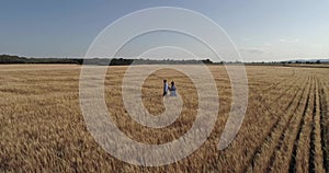 Teenager girl and boy walking on field Happy girl and boy