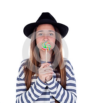 Teenager girl with a colorful lollipop on her mouth