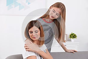 Teenager girl comforting her mother