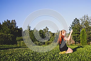 Teenager girl doing sports exercises outdoors in countryside
