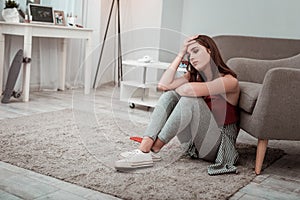 Teenager girl feeling upset while staying at home