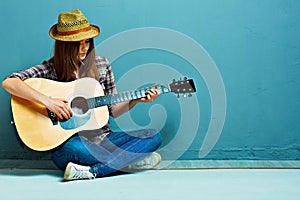 Teenager girl guitar play.