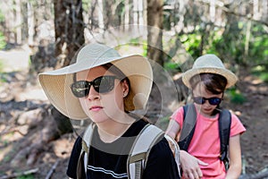 Teenager girl in hat and sunglasses with backpack