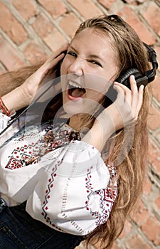 Teenager girl in headphones