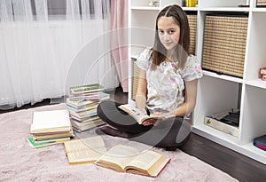 Teenager girl in her room, read a book