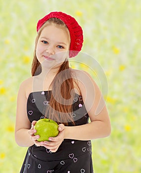 Teenager girl holding a Apple.