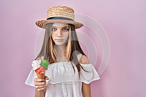 Teenager girl holding ice cream skeptic and nervous, frowning upset because of problem