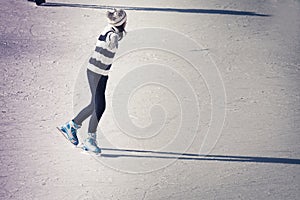 Teenager girl at the ice rink