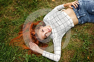 Teenager Girl lying on lawn