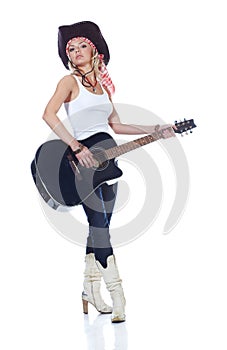 Teenager girl playing with acoustic guitar
