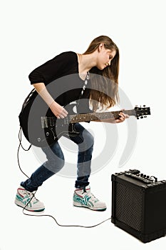 Teenager girl playing guitar