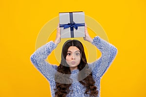 Teenager girl with present gift. Greeting and gifting.