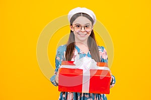 Teenager girl with present gift. Greeting and gifting.