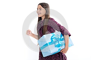 Teenager girl with present gift. Greeting and gifting.