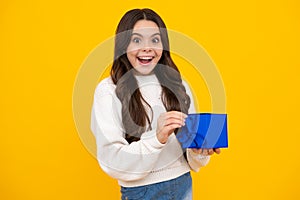 Teenager girl with present gift. Greeting and gifting.