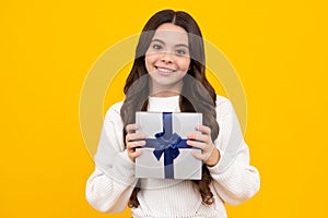 Teenager girl with present gift. Greeting and gifting.