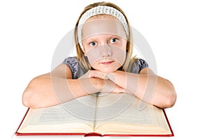 Teenager girl reading a book isolated on white