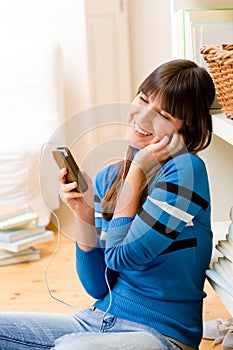 Teenager girl relax home - happy listen to music