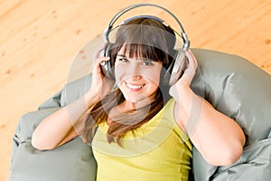 Teenager girl relax home - happy listen to music