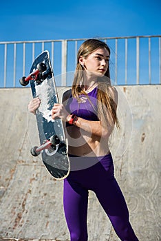 Teenager girl ride her skateboard.  Healthy lifestyle