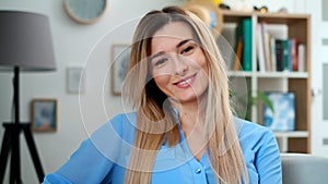 Teenager girl show emotions from serios face to laugh at home. Close up portrait indoor. Beautiful young smilling woman