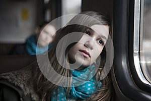 Teenager girl sitting in the carriage