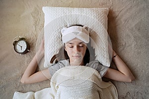 Teenager girl sleeping on white pillow at home