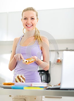 Teenager girl spread toast with chocolate cream