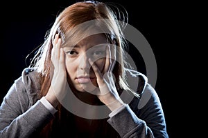 Teenager girl in stress and pain suffering depression sad and scared in fear face expression