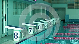 Teenager girl Swimmer Dive In Swimming Pool. Female swimmer dives in swimming pool for a swim exercise.