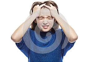 A teenager girl thinks holding her head and closing her eyes. Close-up. Isolated on a white background