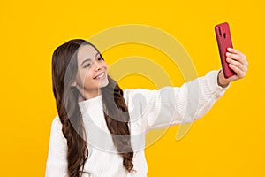 Teenager girl use smart phone, share social media, chatting by mobile phone wear stylish casual trendy clothes isolated