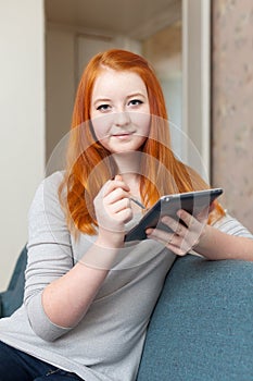 Teenager girl uses electronic book