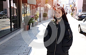 A Teenager girl wearing a black sweater