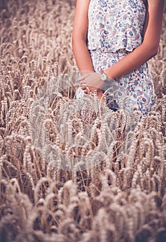 Teenager girl at wheat field